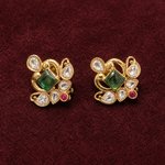 Compact gold-finished floral stud earrings with green, ruby-pink and clear Polki-style stones—ideal for festive and wedding wear.