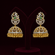 Gold-Plated CZ Diamond Jhumka Earrings with Emerald Accent – Traditional Bridal Jewelry