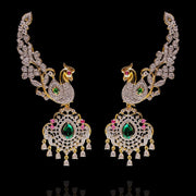 Enchanting Peacock Ear Cuffs Design with Statement Emerald Drops