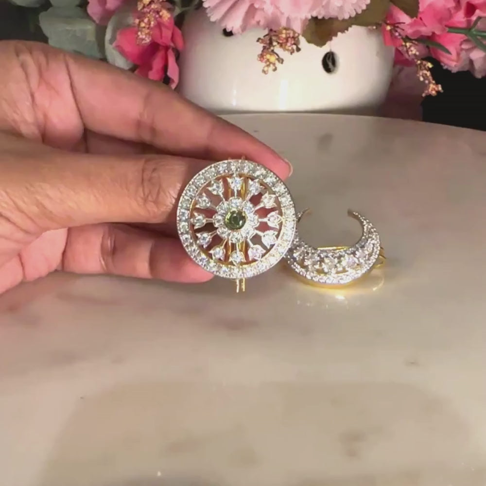 Surya-shaped hair clip is an ornate and intricate piece of hair jewelry designed to reflect the radiance and elegance associated with a South Indian bride.