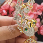 Enchanting Peacock Ear Cuffs Design with Statement Emerald Drops